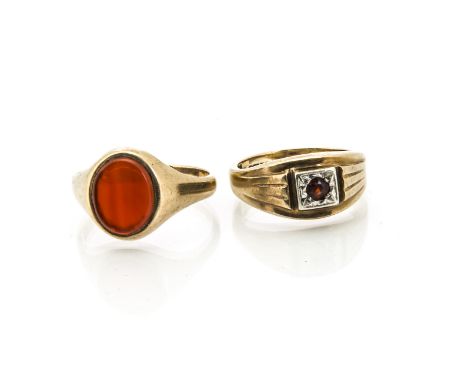 Two gem set 9ct gold gentleman's rings, including a cornelian signet ring, ring size V and a garnet example ring size Q (2)9.