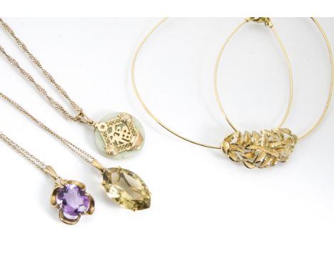 A 9ct gold citrine pendant and chain, an amethyst example, a continental jade pendant and chain and another 