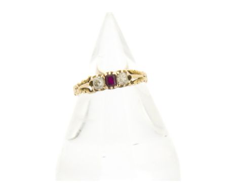 A 19th Century ruby and diamond child's ring, the step cut ruby flanked by two old cut diamonds with leaf shoulders on a yell