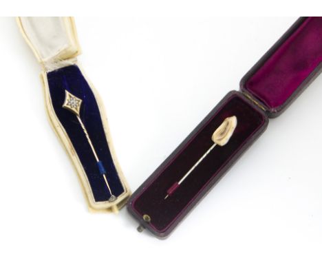 A late 19th Century 18ct marked diamond stick pin, in an ivorine case together with a tooth mounted stick pin in leather case