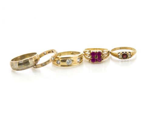 A continental high carat gold and synthetic ruby dress ring, 5g, together with a garnet and diamond 18ct gold three stone rin