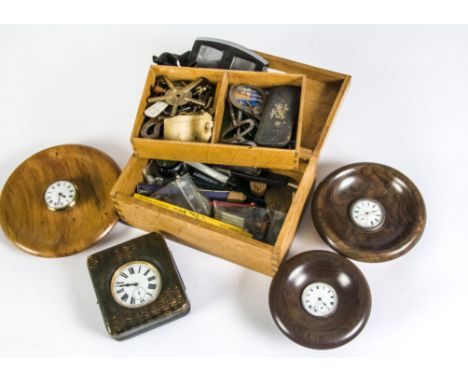 A small group of watch repairing tools and keys in oak box, together with three timepieces in wooden bases, a Goliath pocket 