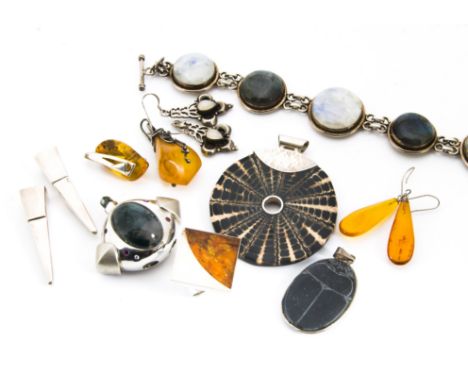 A collection of contemporary amber and hardstone set silver jewellery, including a modern amber and silver dress ring, two si