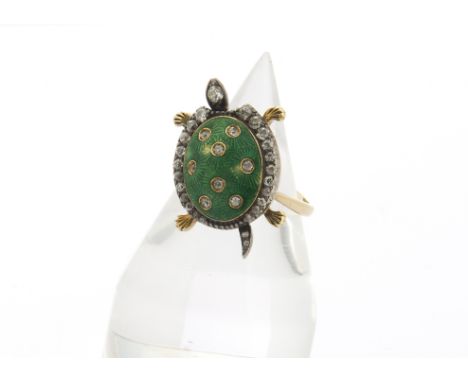 A novelty diamond and enamel tortoise dress ring, the tablet top with domed translucent green top set with sunken old cut dia