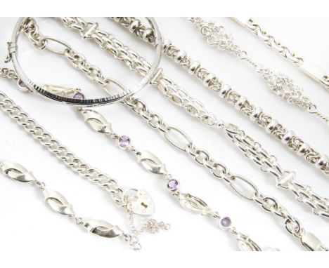 Eight silver bracelets, various decorations, one amethyst set example and a silver bangle 146g 