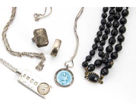 A collection of silver and costume jewels, including an albert and medallion, silver ingot, an enamel silver St Christopher a