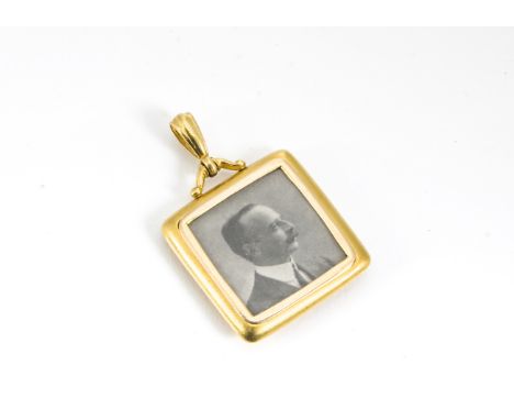 A 15ct gold square shaped open faced locket, with black and white portrait of a gentleman, total weight 6.7g 