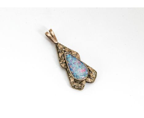 A black opal and gold pendant, the tear cut opal within a floral mount, total length 14cm x 1.6cm wideYes, it is solid opal, 