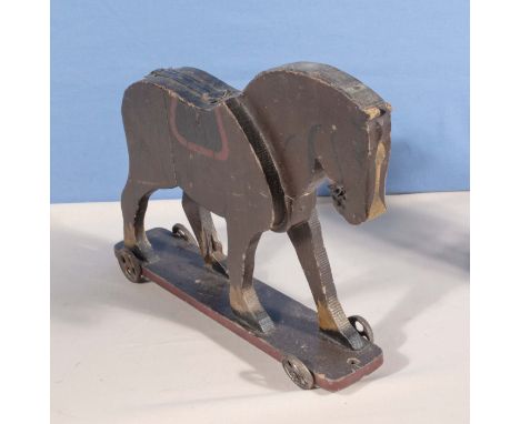A vintage pull along wooden horse