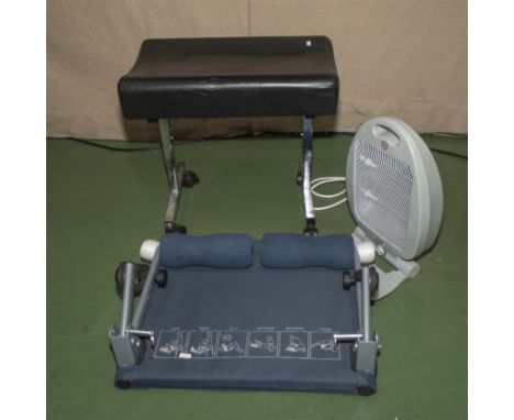 A stool, exercise bench and a fan heater