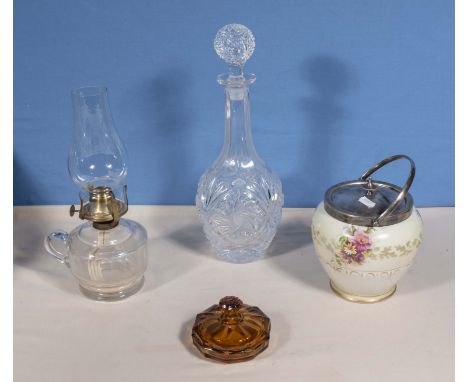 A pottery biscuit barrel. decanter, oil lamp and one other