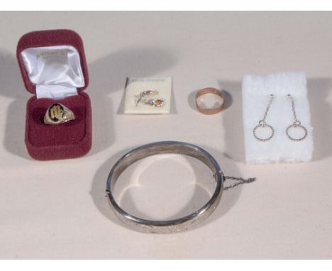 A silver bangle, two pairs of silver earrings and two rings