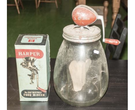 A vintage butter churn and a vintage mincer