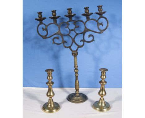 A large five branch candelabra and two small ones