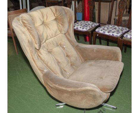 A retro egg chair, vintage swivel armchair 