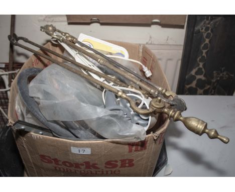 A box of assorted items including fire irons and tools