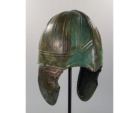 Ca. 400 BC. Very Rare Greek Chalcidian type Helmet with cheek-guards; embossed with geometric pattern; Similar helmets were w