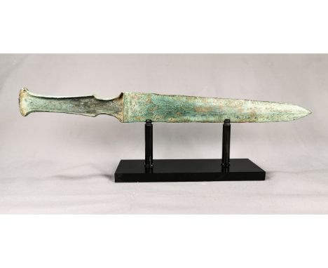 Ca. 800 BC. Rare Greek Archaic period decorated sword with intact handle; a fine example; sword with a narrow handle designed