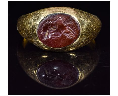 Ca.100 AD. A fantastic Roman Gold intaglio ring with the portrait of Goddess Minerva; Good condition, wearable; D:18mm/L:25mm