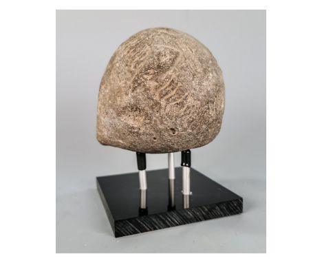 Ca.800 AD. A hollow ceramic vessel with barrel-shaped body, domed top, and conical base, the body with a latticework design; 