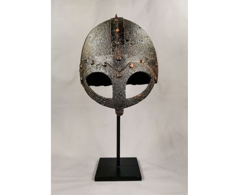 Ca. 800 - 1100 AD. Rare medieval four-plate iron helmet with face guard; formed of triangular sections; attached with iron ri