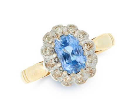 A SAPPHIRE AND DIAMOND DRESS RING in 18ct yellow gold, set with a cushion cut blue sapphire of 1.26 carats within a border of