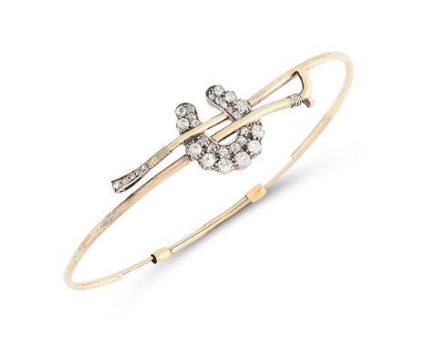 AN ANTIQUE DIAMOND BANGLE, 19TH CENTURY in yellow gold, designed as a riding crop, with applied horseshoe motif jewelled with