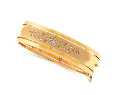 A DIAMOND BANGLE in 18ct yellow gold, with applied matte panel set with rose cut diamonds in floral and foliate designs, Fren