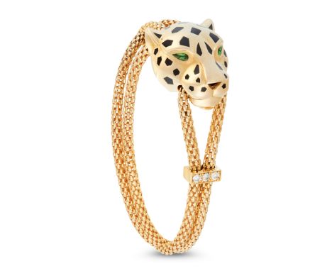 A GARNET, DIAMOND AND ENAMEL PANTHERE DE CARTIER BRACELET, CARTIER in 18ct yellow gold, designed as the head of a panther, de