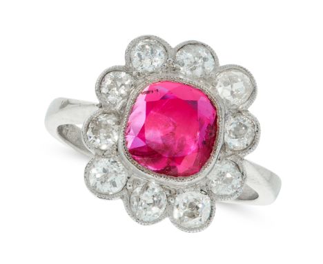 A BURMA NO HEAT RUBY AND DIAMOND CLUSTER RING in platinum, set with a cushion cut ruby of 2.16 carats in a border of old cut 