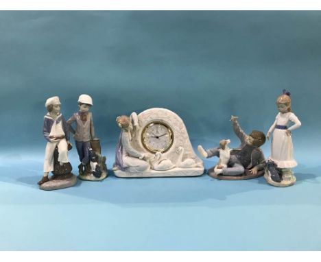 Lladro clock group and a figure of a young sailor and three Nao figures