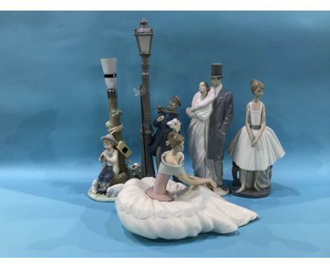 A collection of Nao and Lladro figures