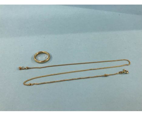 A 18ct ring and a chain stamped '750', 8.7g