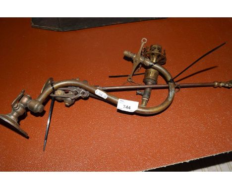 Two brass wall gas lamps and a brass toasting fork