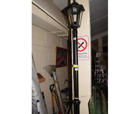 A modern garden light in the form of vintage street lamp