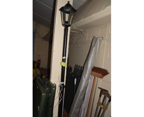 A modern garden light in the form of vintage street lamp
