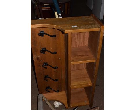 A wall mounted coat rack and storage caddy