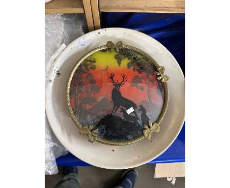 An unusual wall lamp modelled as a concave disc with a scenic view with a stag, with light up bulb behind