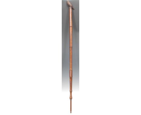 A Black Forest type walking stick, the handle carved as a bird, bamboo cane, 119cm long