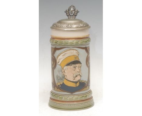 A German Metlach stoneware stein, decorated in polychrome with a portrait of Paul von Hindenburg (1847 - 1934), silver plated
