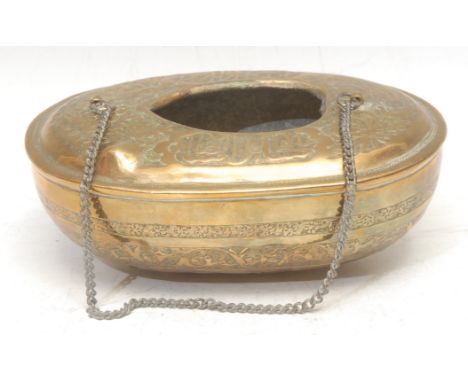 A Middle Eastern brass kashkul [kashkoul] alms or begging bowl, chased in the Persian taste with Arabic calligraphy, Islamic 