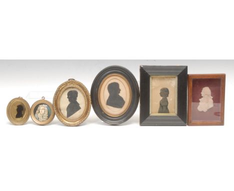 English School (19th century), a cut paper silhouette, half length portrait of a young girl facing to dexter, heightened in g