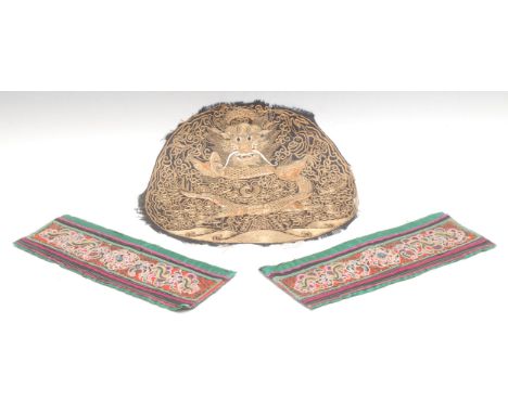 Textiles - a Chinese silk rank badge, worked in gilt threads with a dragon, 27.5cm diam, Qing Dynasty; a pair of sleeve panel