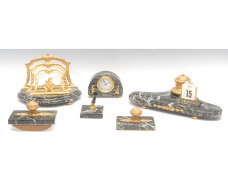 A Louis XVI style serpentine and ormolu mounted writing desk garniture, comprising seven pieces, the combination inkwell and 