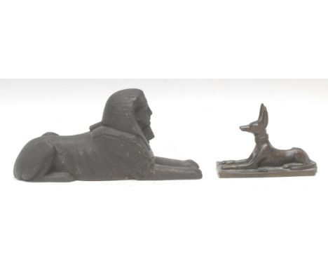 An Egyptian cabinet bronze, of the god Anubis, after the antique, 11.5cm long; a dark patinated bronze, King Thutmosis III as