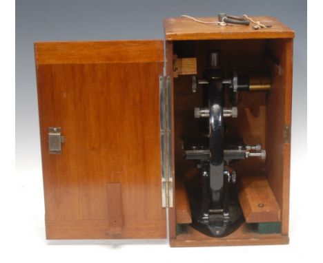 An early 20th century black lacquered microscope, C. Baker 31110, mahogany case, 41.5cm high to handle, 20.5cm wide, 23cm dee