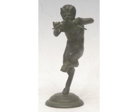 A patinated bronze, of a Pan, he stands with one leg raised, playing pipes, circular base, 12cm high