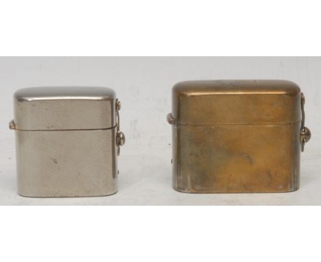 An early 20th century brass travelling inkwell, hinged armorial cover with crest and motto Ever Ready, 5cm high, c.1910; anot