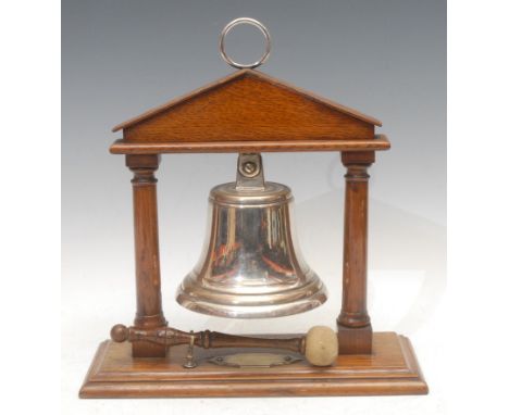 A late Victorian oak table top dinner gong, the silver plated bell within an architectural portico, rectangilar base, 31.5cm 