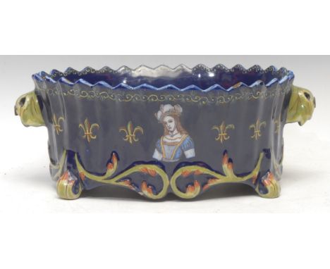 A 19th century French faience jardinière, the sides hand-painted with a portrait bust of Joan of Arc and the coat of arms of 